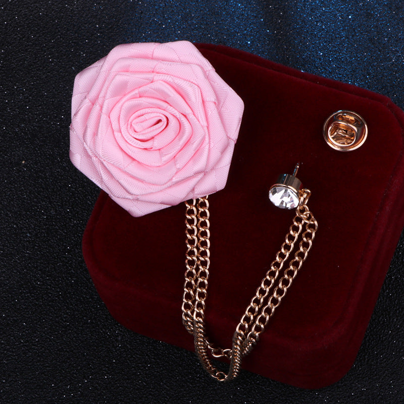 Elegant floral brooch displayed on wooden background
