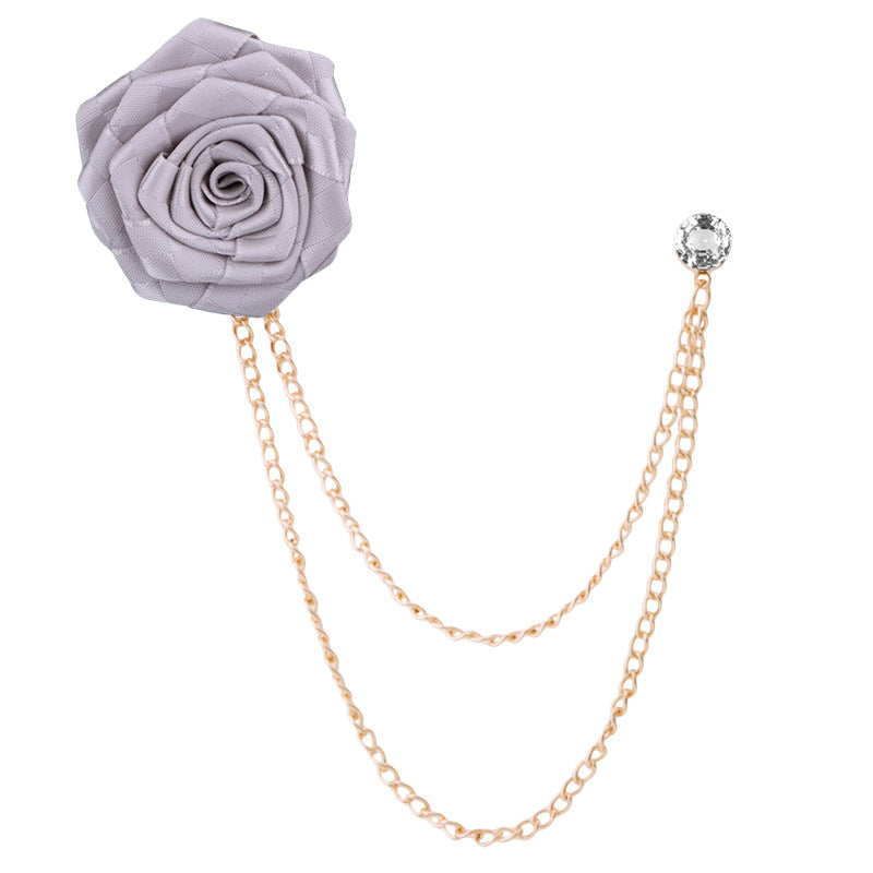 Elegant floral brooch displayed on wooden background