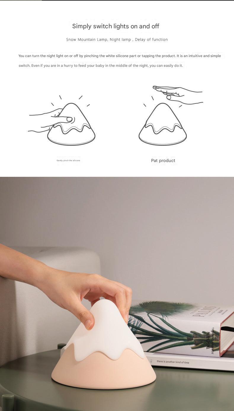 mountain-shaped LED night light on desk