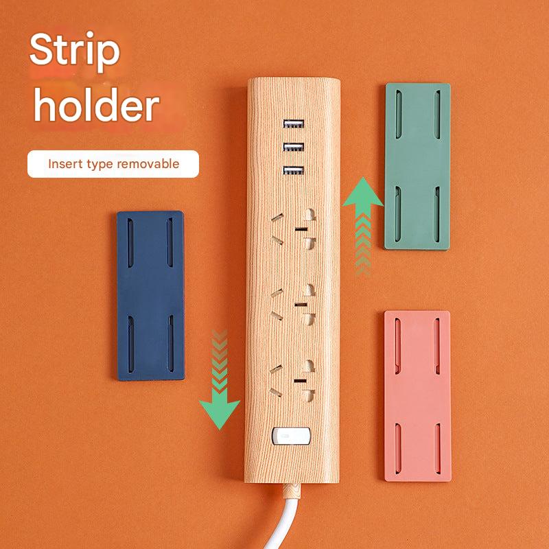 close-up of wall-mounted power strip holder