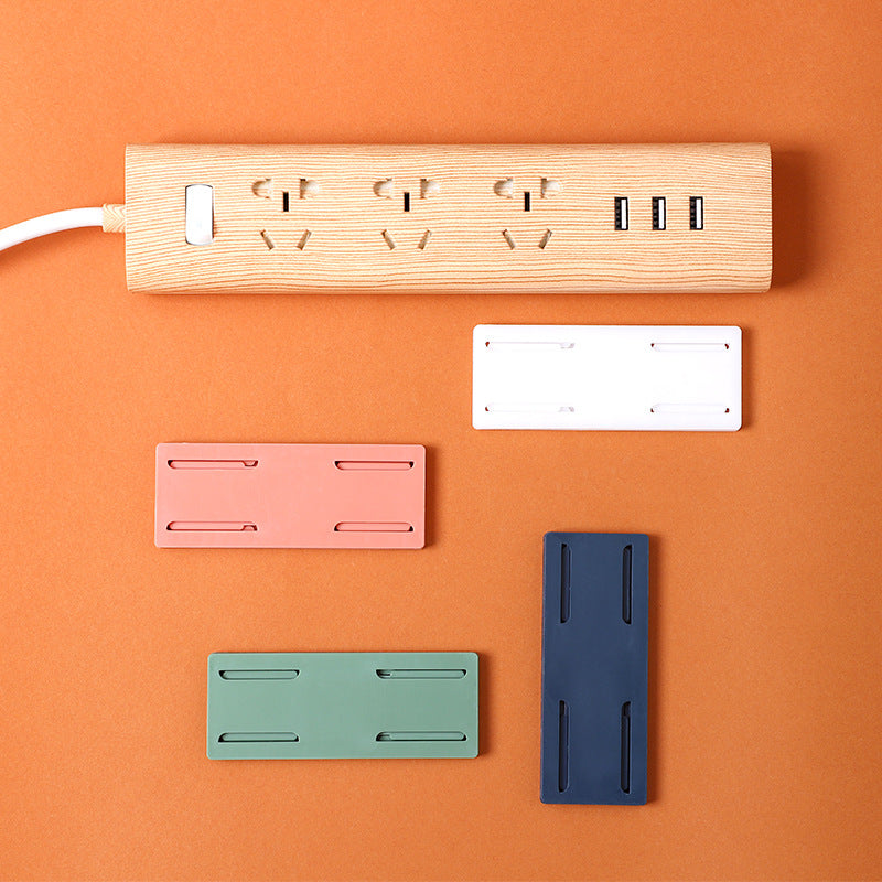dual power strip holders mounted on white wall