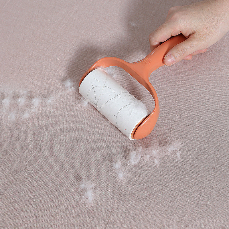 pink lint roller with visible lint