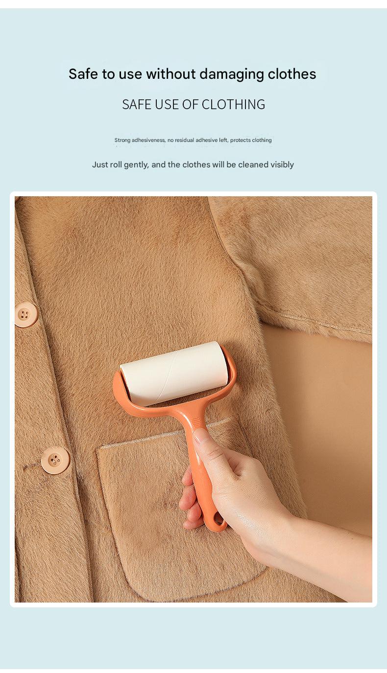 lint roller being used on coat