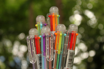 colorful stack of ballpoint pens close-up