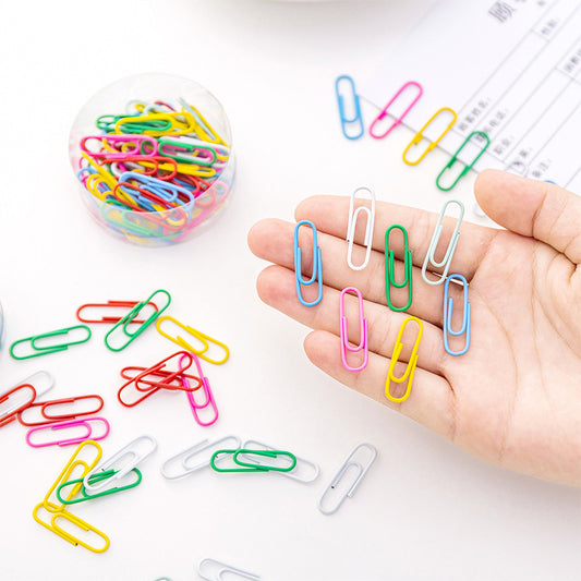 Multicolor paper clip on white background