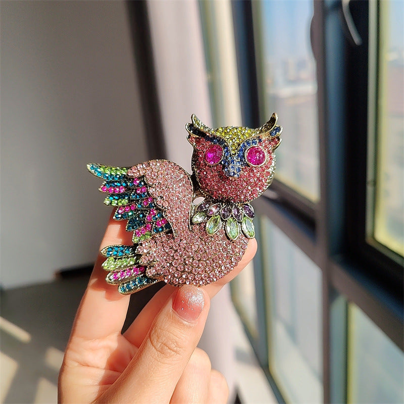 Stylish owl brooch worn as a pin