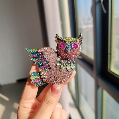 Stylish owl brooch worn as a pin