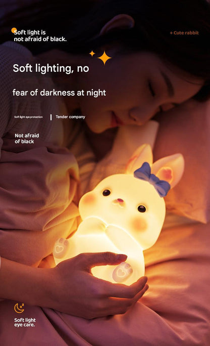 Kids enjoying colorful bunny-shaped LED lamp