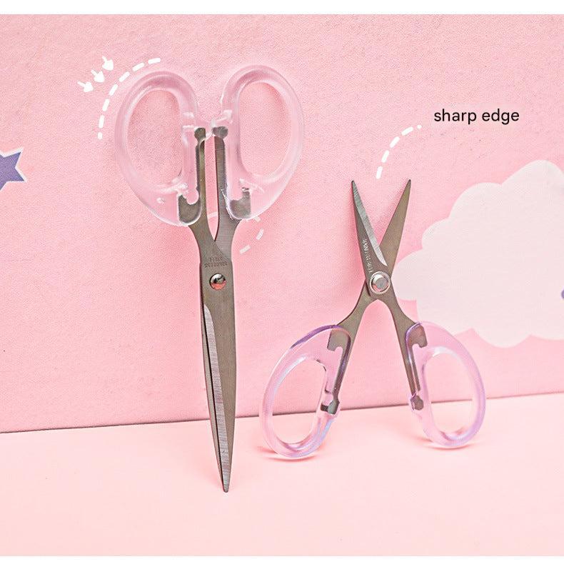 stainless steel scissors with transparent handle on white