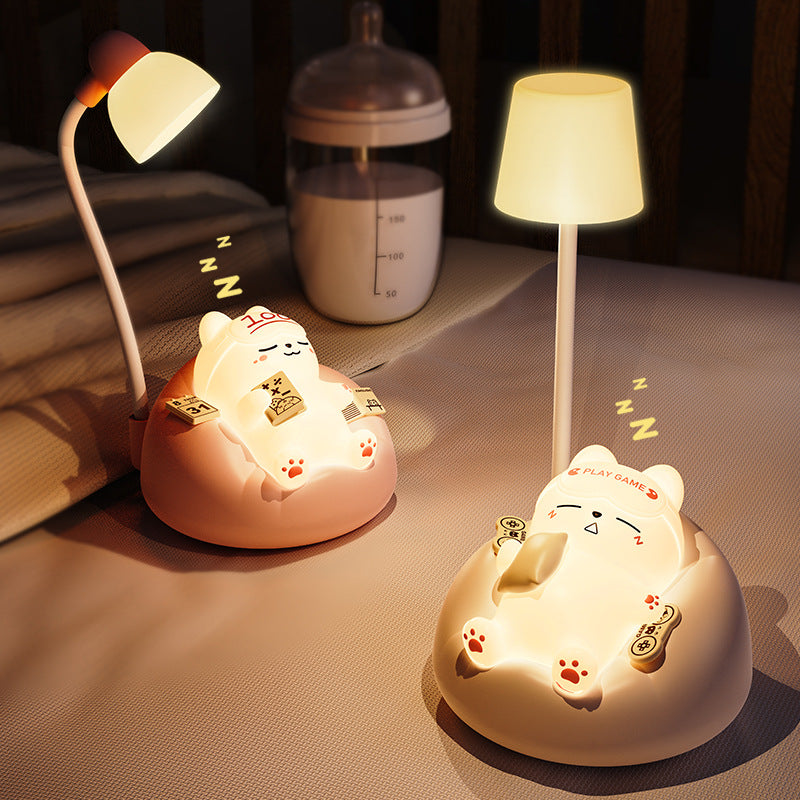 Adorable cat night light on white background