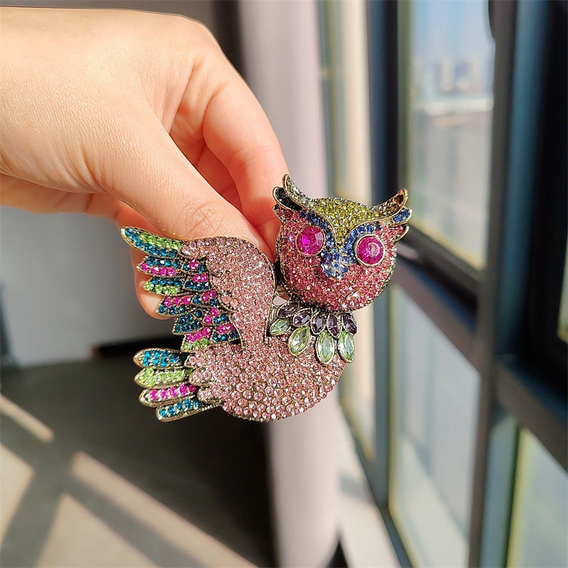 Elegant vintage owl brooch side view
