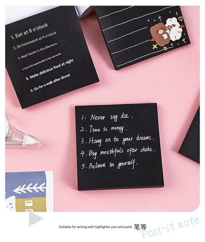 pack of black sticky notes open package