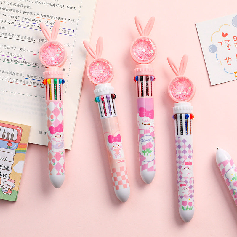 rabbit-themed multi-color ballpoint pen held in hand