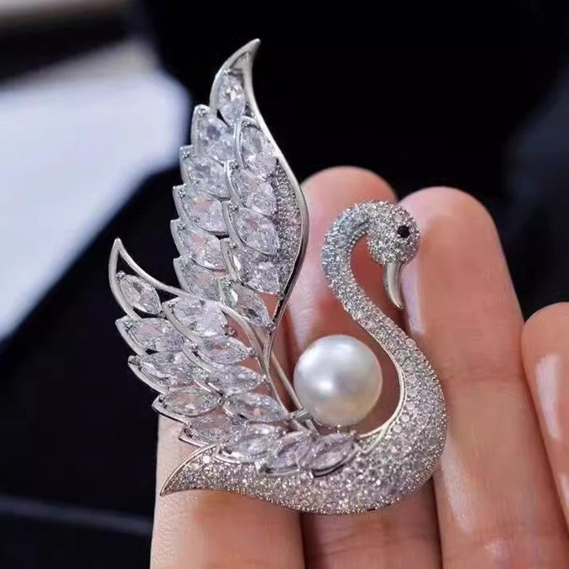 Swan pearl brooch with zirconia crystals image 1