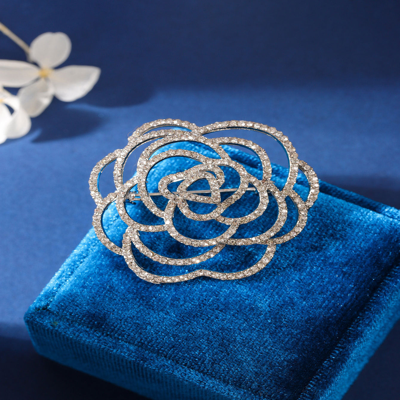 Rhinestone embellished brooch on a dress
