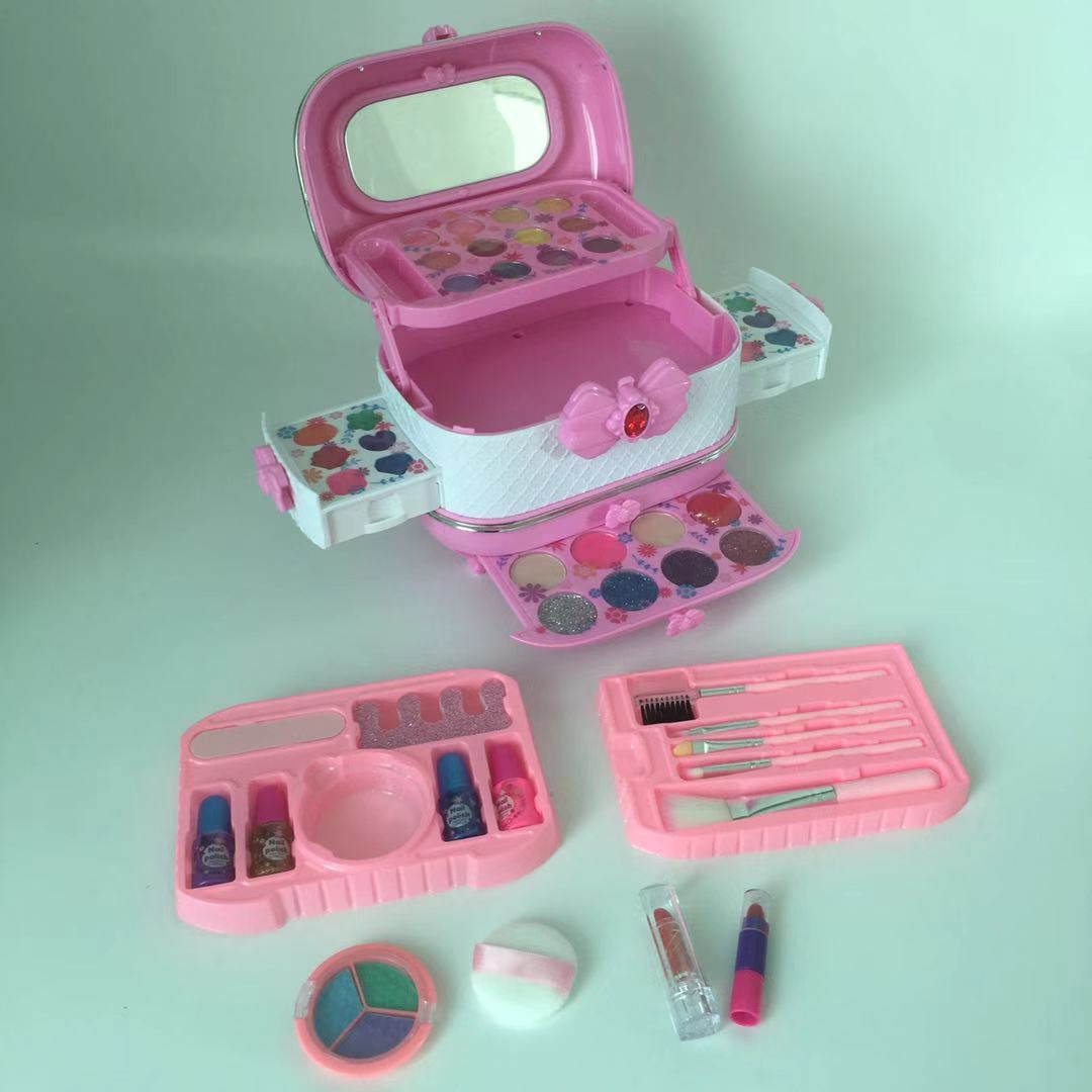 child playing with complete makeup set open box