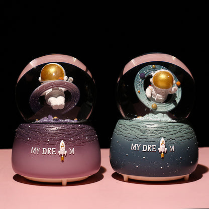 Astronaut collectible with light and snow features