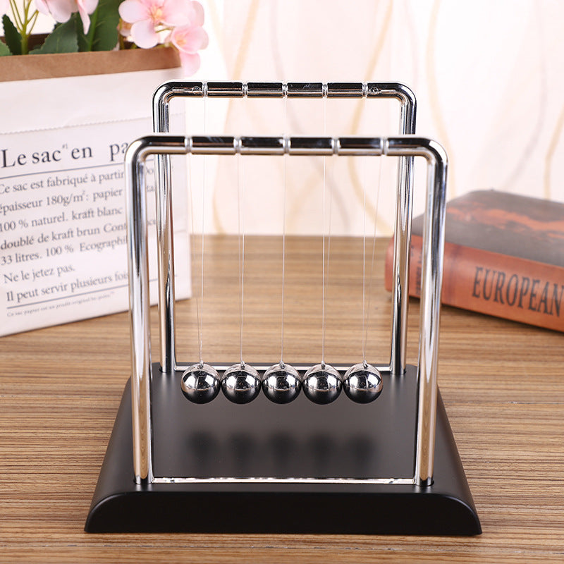 View of medium-size Newton's Cradle on office desk