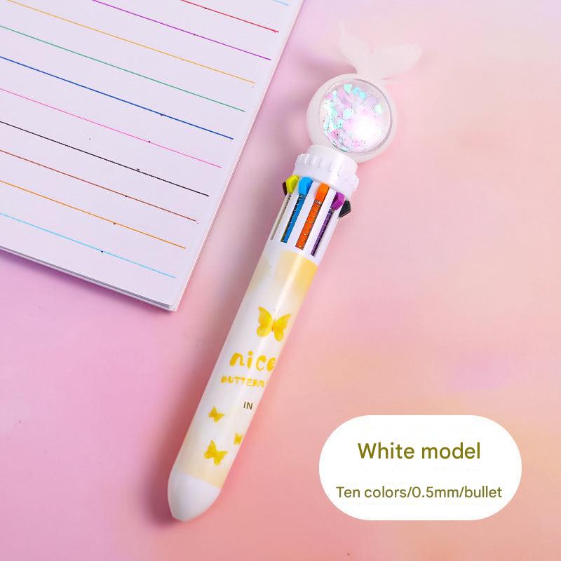 Multicolor ballpoint pen laid on test paper image