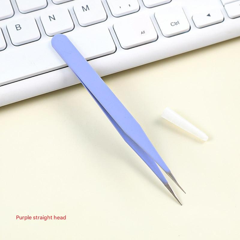 craft tweezers holding paper detail