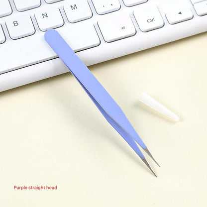 craft tweezers holding paper detail