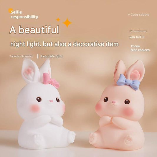 Cute bunny LED night light with child playing