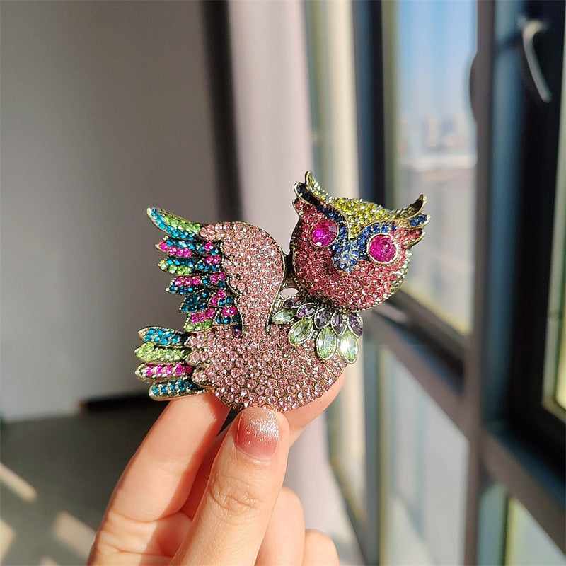 Owl brooch on a jewelry display