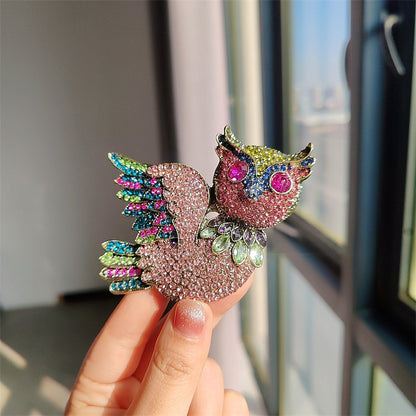 Owl brooch on a jewelry display