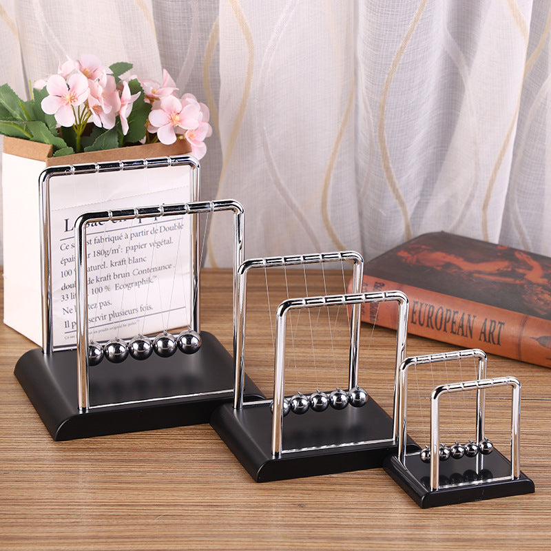 Newton's Cradle kinetic desk toy with black base