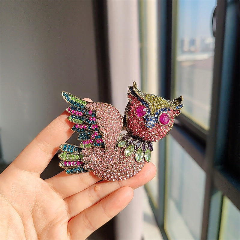 Owl brooch with rhinestones front view