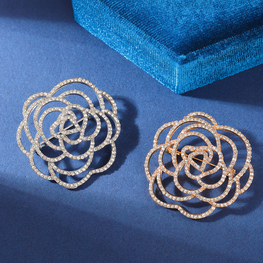 Charming flower brooch displayed on fabric