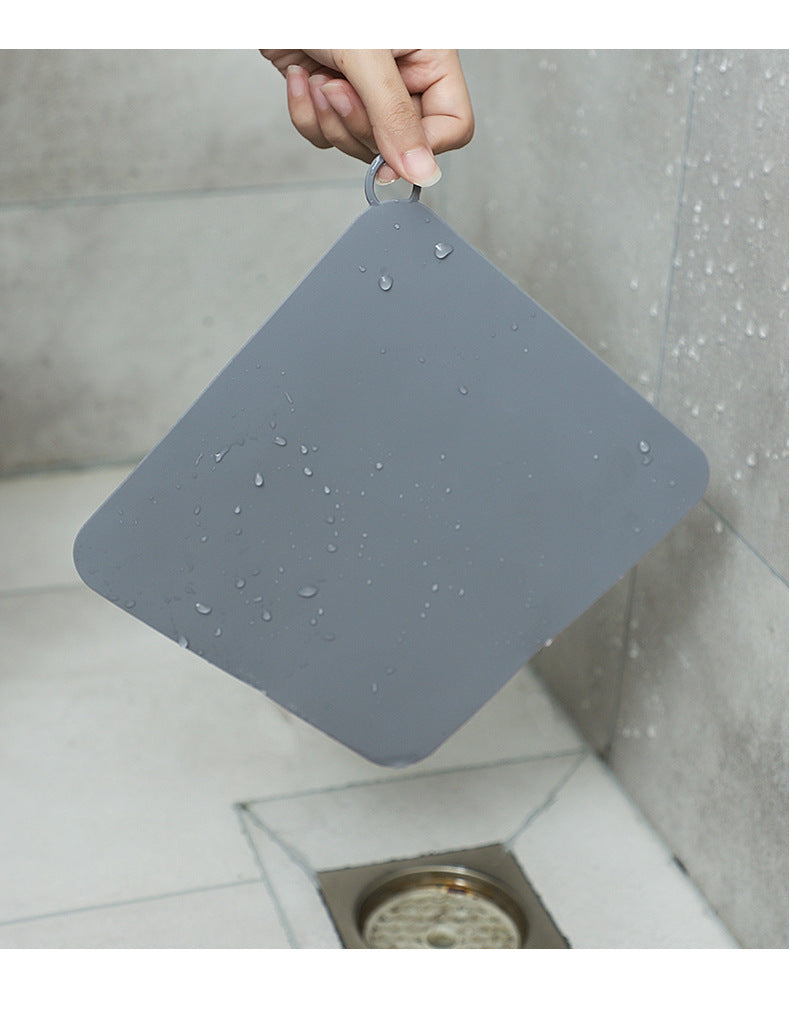 Odor-blocking bathroom mat
