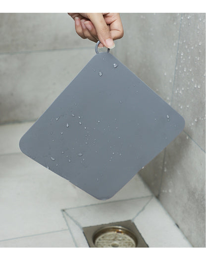 Odor-blocking bathroom mat
