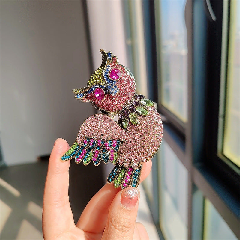 Fashionable owl jewelry on a dark background