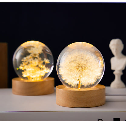 artistic LED-lit dandelion crystal ball on wooden stand