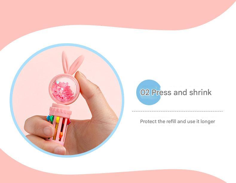 rabbit-themed multi-color ballpoint pen held in hand