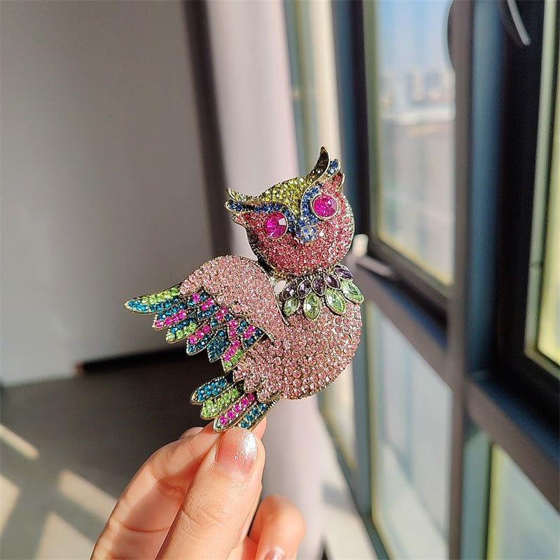 Elegant vintage owl brooch side view