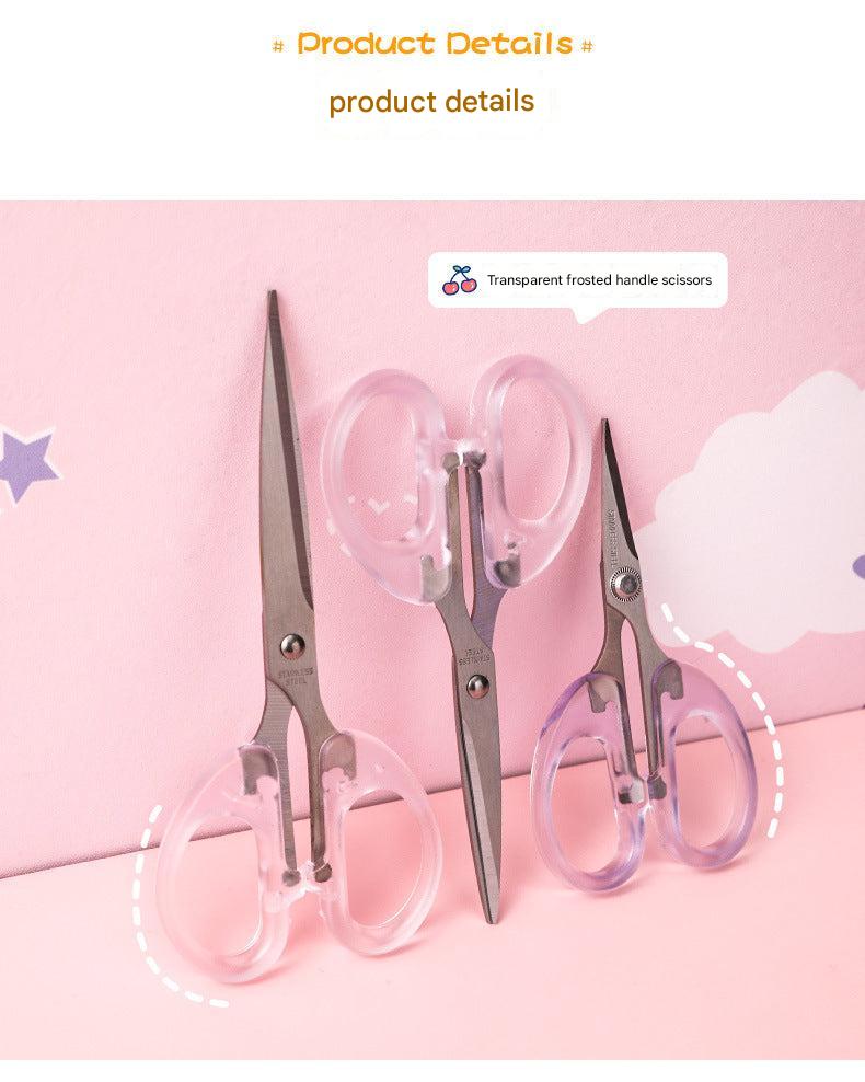 stainless steel scissors with transparent handle on white