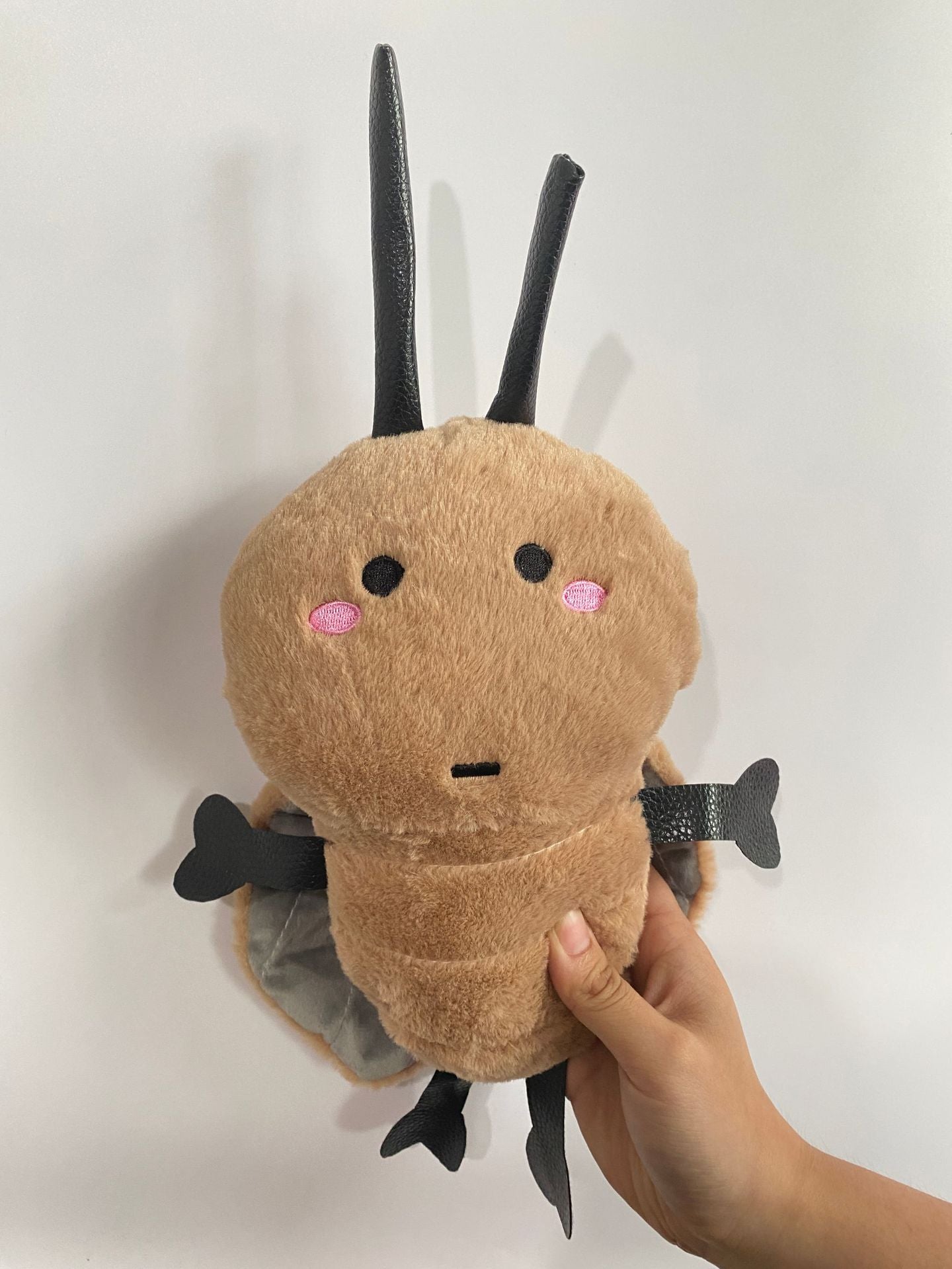 quirky roach plush toy