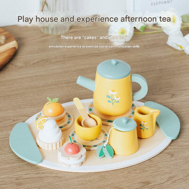 child playing with wooden kitchen set